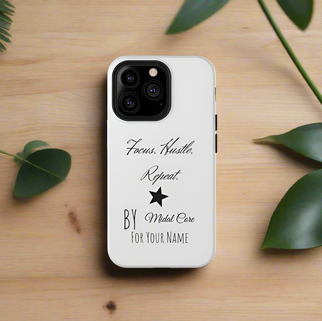 Front View of a motivational phone case posed on a wooden table for the iPhone 13 pro made by Midal Core