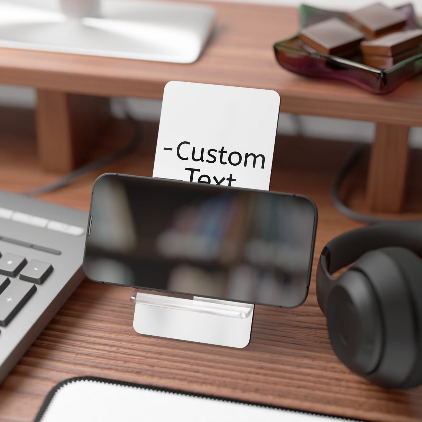 Front view of a custom mobile stand in action with a phone on it made by Midal Core