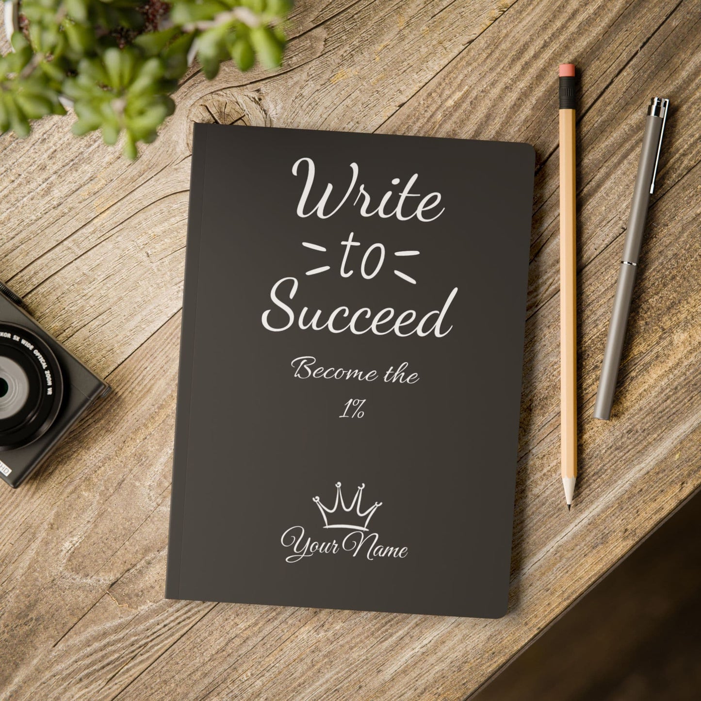 an inspirational notebook posed on a table by midal core