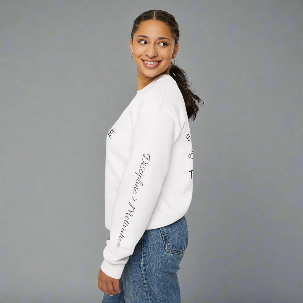 Side view of model in white motivational sweatshirt