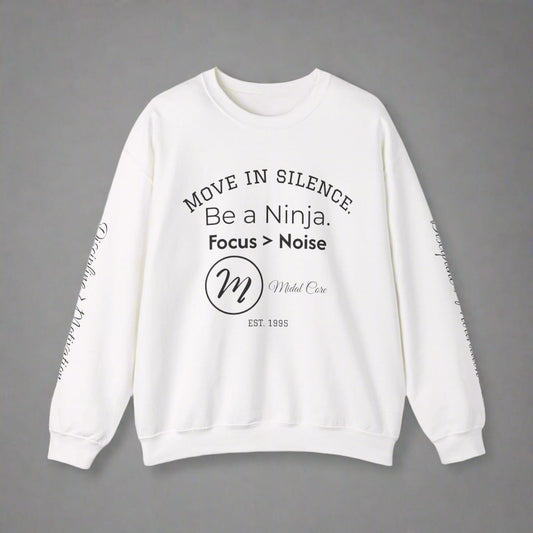 Front view of white Midal Core sweatshirt with “Move in Silence” quote