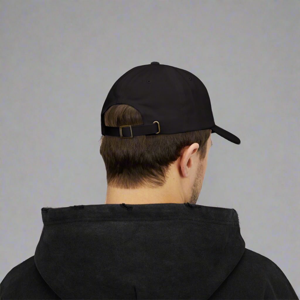 A motivational black dad cap made by midal core wore by a man