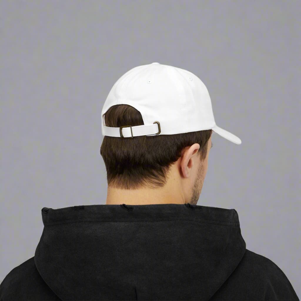 A motivational white dad cap made by midal core wore by a man