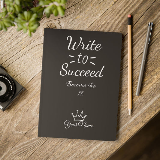 an inspirational notebook posed on a table by midal core